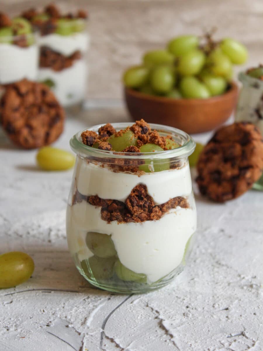 Layered dessert with curd cheese, cookies and grapes kitchensplace